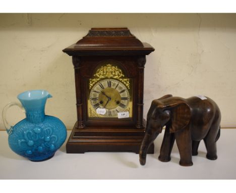 A mantel clock, 28 cm wide, a carved wood elephant, other elephants, glass, pictures, metalwares and items (qty) 