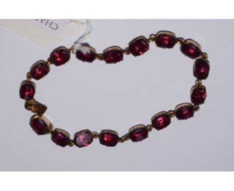 A Victorian yellow coloured metal and amethyst bracelet
