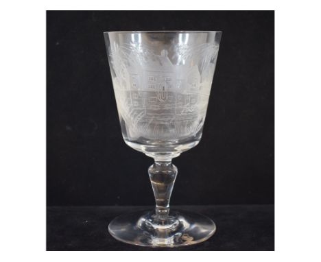 A Baccarat etched wine glass, decorated a house, 15.5 cm high, two etched glass decanters, other assorted coloured and clear 