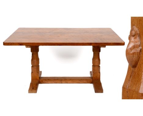 A Robert Mouseman Thompson oak refectory style table, on octagonal legs and sledge feet, joined by a stretcher, 152.5 cm wide