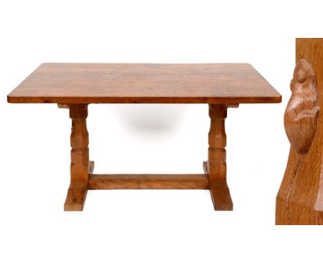 A Robert Mouseman Thompson oak refectory style table, on octagonal legs and sledge feet, joined by a stretcher, 152.5 cm wide