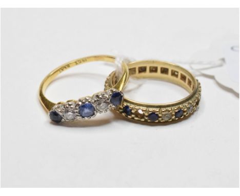 An 18ct gold, platinum, five stone sapphire and diamond ring, approx. ring size N, and an eternity ring, lacks two stones, ap