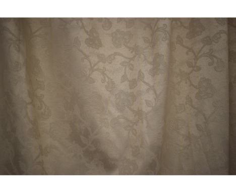 A pair of cream curtains, with floral motifs, each approx. 285 x 265 cm