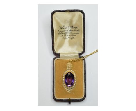 A 15ct gold, amethyst and seed pearl pendant/brooch, on a 15ct gold chain, boxed    Condition report  Report by NGBrooch/pend