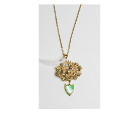 A Chinese pendant, in the form of a dragon, with a green hard stone shield drop, on a 9ct gold chain