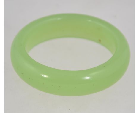 A heavy vintage Chinese pale green jade bangle. 6cms diameter