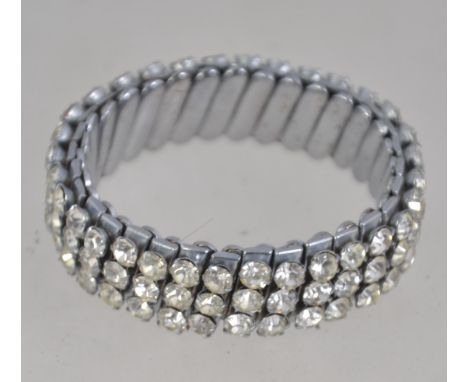 A vintage silver tone expanding bracelet cuff set with rhinestones