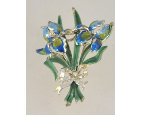 A 1950's enamel brooch by Exquisite in the form of Iris flowers. Marked to the back with gold tone and rollover clasp
