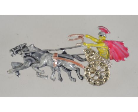 A vintage 1950's silver tone and enamel figural brooch pin of a Roman driving a horse drawn chariot set with marcasites with 
