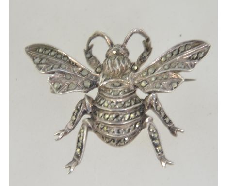 A large vintage silver figural bug brooch pin in the form of a bumble bee set with marcasite with roller clasp. Tests silver.