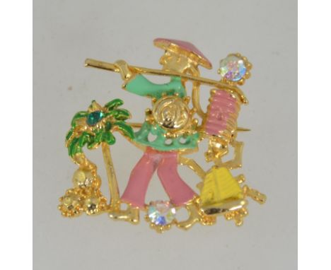 A vintage 1950's gold tone and enamel figural brooch pin of a oriental person set with Aurora Borealis rhinestones and roller