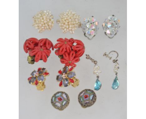 An assorted collection of mostly 1950's vintage clip and screw earrings set includig seed pearl clusters, large plastic flora