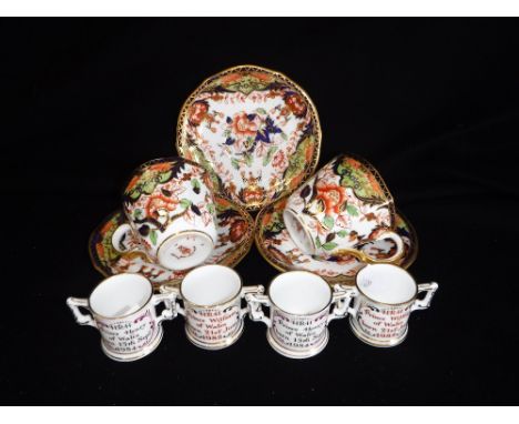 A SET OF FOUR MINIATURE ROYAL CROWN DERBY PORCELAIN TWIN HANDLED CUPS and a pair of Royal Crown Derby porcelain coffee cups a