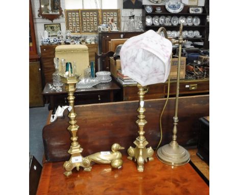 A PAIR OF BRASS 'ALTAR' CANDLESTICKS in a baroque design, 17" high including pricket, an Edwardian style brass table lamp and