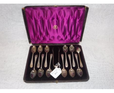 A SET OF TWELVE ENGRAVED SILVER TEASPOONS AND SUGAR TONGS, in a fitted 'R. Stewart, Glasgow', presentation case