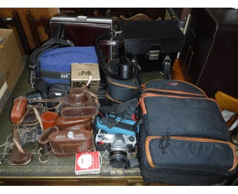 A LARGE COLLECTION OF PHOTOGRAPHIC EQUIPMENT, to include a Diax camera, a cine camera, lenses and accessories (as lotted) 