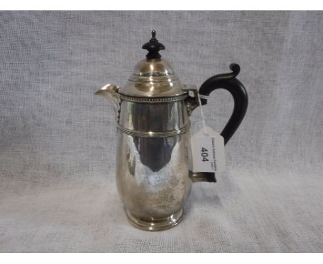A SILVER WATER POT with ebony handle and finial, 8" high