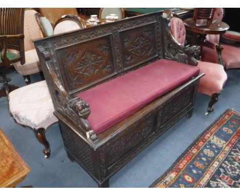 A VICTORIAN CARVED OAK HALL BENCH