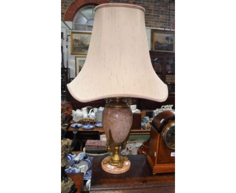 A ROUGE MARBLE AND ORMOLU TABLE LAMP, supported by grotesque winged beasts, with silk shade, 20" (to tip of electric fitting)