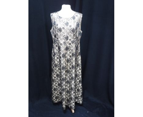 A VINTAGE BLACK GOLD AND TAN BROCADE EVENING DRESS with swirl decoration circa 1960's and three other vintage evening dresses