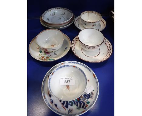 A CHINESE EXPORT PORCELAIN TEA CUP AND SAUCER with polychrome painted decoration, one other similar tea cup and saucer and ot