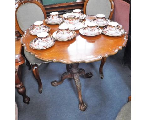 A REPRODUCTION MAHOGANY  TRIPOD TABLE with a pie-crust top, 32.5" dia