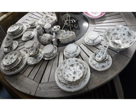 A JAPANESE DINNER AND TEA SERVICE decorated with hand painted purple flowers 