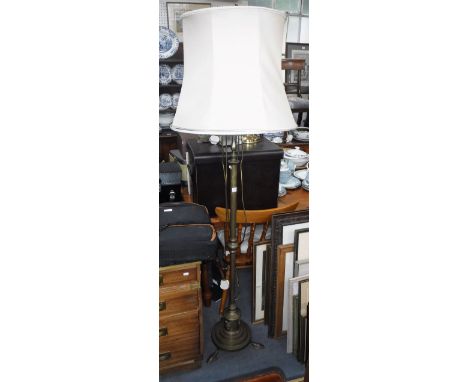A 1920S BRASS STANDARD LAMP