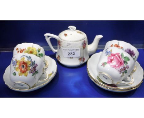 A SET OF FOUR MEISSEN PORCELAIN CABINET CUPS AND THREE SAUCERS and a ceramic teapot with transfer printed floral decoration