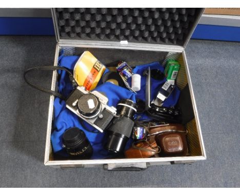 NIKON CAMERA, one other Kodak camera, lenses and other camera equipment in a  metal box