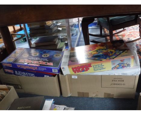 A COLLECTION OF BOXED GAMES and a collection of Vintage games contained in a leather suitcase
