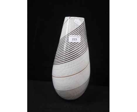 AN EARLY/MID 20TH CENTURY VENETIAN  GLASS VASE with ruby, white and copper flecked spiralled decoration, 12.5" high