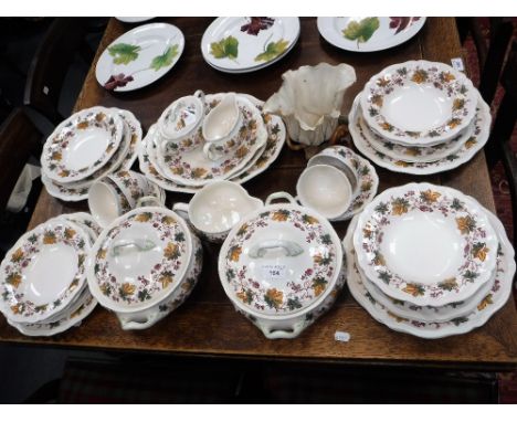 A ROYAL DOULTON 'INDIAN SUMMER' DESIGN DINNER SERVICE and a Worcester vase in the form of a flower