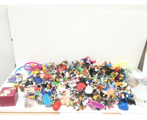 A large collection of model figures mainly being Looney Tunes characters.