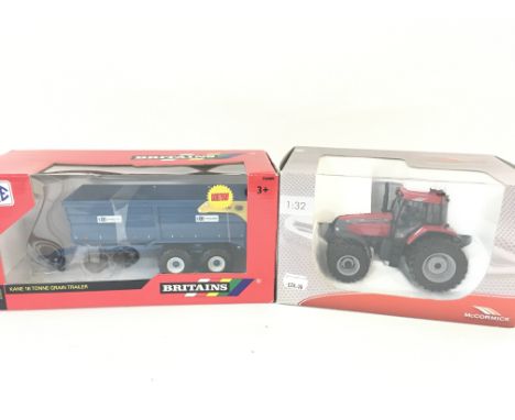 A Boxed Britains Kane 16 Tonne Grain Trailer #42701. And a Universal Hobbies MCCormick Tractor. Both 1:32 Scale.