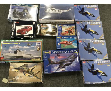 A Collection of Various Model Kits Some have Been Started.