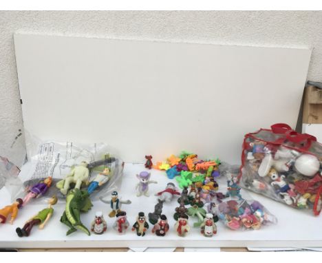 A large collection of model figure reflecting..the wombles..scooby doo..snoopy and others.
