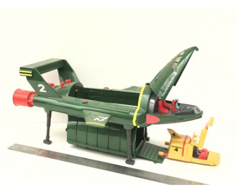 Large model of Thunderbird 2 with Thunderbird 4 in the pod. Includes two pilots. Approximately 16inches long