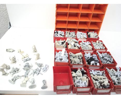 A set of plastic storage drawers contains approximately 300 metal model figures from. Warhammer collection all unpainted. Mad