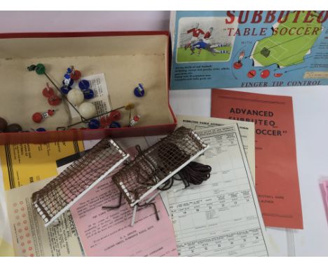 A 1959 Subbuteo set. Pitch missing.
