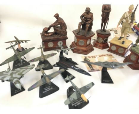 A collection of miliatary model memorabilia relating to various wars including ww1 and ww11. Includes model aircraft. Include