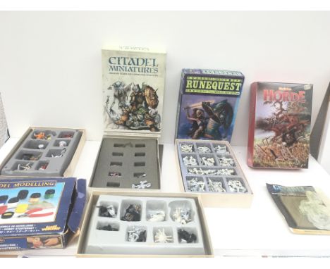 A group of 5 boxes containing metal and plastic model figures from a warhammer collection.  Also includes resin stone dragon 