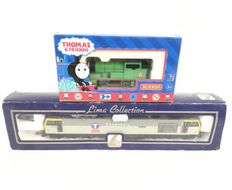 2 Boxed 00 Gauge Locomotives a Lima Diesel Locomotive. a Hornby Thomas And Friends Percy. And a Collection of Buildings Etc.