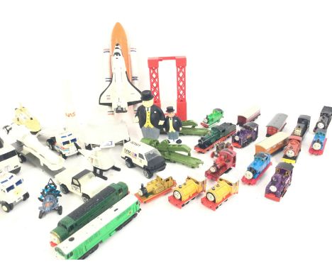 A Box Containing a Collection of Ertl Thomas the Tank Engine Trains and Tonka NASA toys.