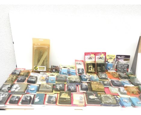 A collection in excess of 50 packaged metal model figures in original bubble display boxes .  From a Warhammer collection.