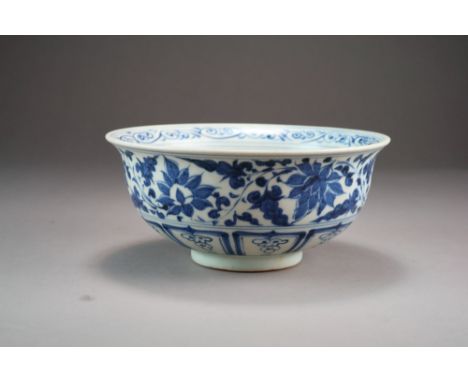 A Chinese blue and white bowl, of rounded form with flared rim and raised on a short foot ring, decorated in the Yuan style w