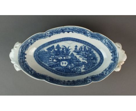 A Caughley radish dish transfer-printed with the Full Nankin pattern, circa 1784-92, unmarked, 29.5cm wide (chipped, stained)