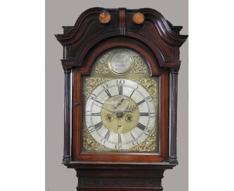 Thomas Kenerdell, Wigan, a George III mahogany longcase clock the arched hood with scroll pediment and boxwood patera enclosi