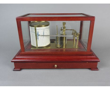 A modern barograph, 20th century in mahogany effect bevelled five glass case with clockwork mechanism stamped Gluck Barograph