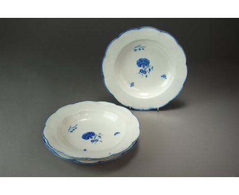 Three Caughley shallow dishes painted with the Carnation pattern between osier moulded borders, circa 1790, S mark, 24cm diam